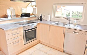 Fridge, stovetop, dishwasher, coffee/tea maker