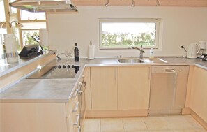 Fridge, stovetop, dishwasher, coffee/tea maker