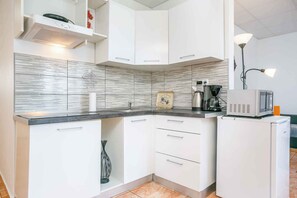 Fridge, microwave, stovetop, coffee/tea maker