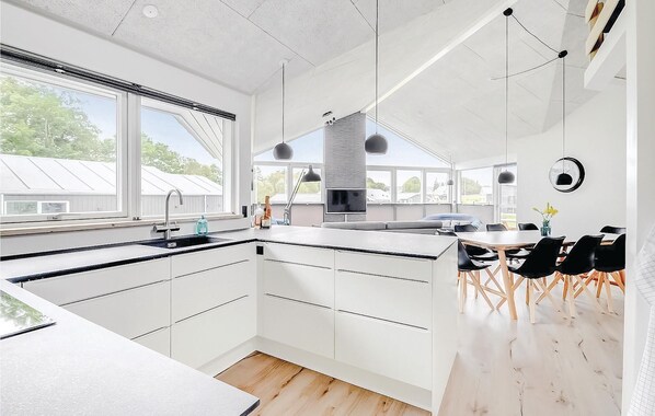 Fridge, stovetop, dishwasher, coffee/tea maker