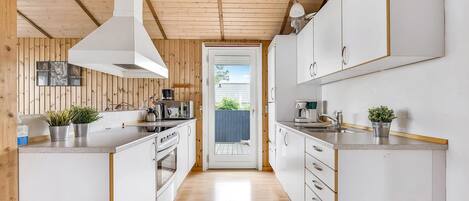 Fridge, stovetop, dishwasher, coffee/tea maker