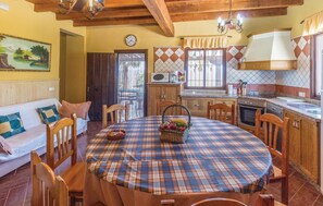 Enjoy meals in this inviting dining area with a round table and comfortable seating.