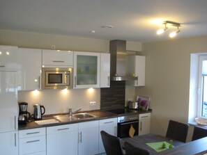 Unclassified image, 2 of 14, button - 2-room 103 Juist Balk Spülm. (BC 5) - BUE - Apartment house Westwind (Büsum)