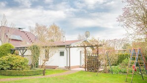 A residential property with a garden, a play area, and a satellite dish. - FH Herve, Monica GM 69206-FH Cather (Graal-Müritz)