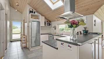 Fridge, stovetop, dishwasher, coffee/tea maker