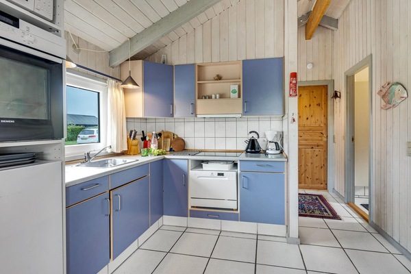 Fridge, stovetop, dishwasher, coffee/tea maker