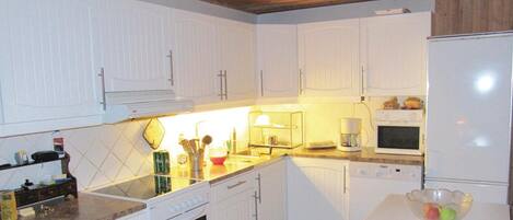 Fridge, stovetop, dishwasher, coffee/tea maker