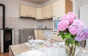 Fridge, stovetop, dishwasher, coffee/tea maker