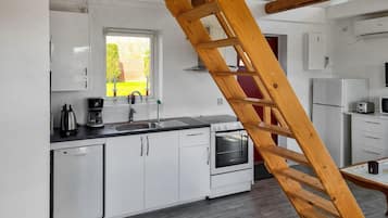 Fridge, stovetop, dishwasher, coffee/tea maker