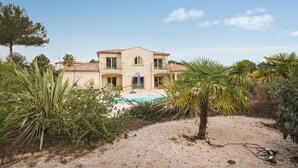 A two-story house with a swimming pool surrounded by tropical plants. - Stunning home in Saint Raphael (Saint Raphael)