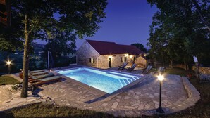 A stone pool with lounge chairs and a stone building with a red roof. - Beautiful home in Hrvace (Hrvace)