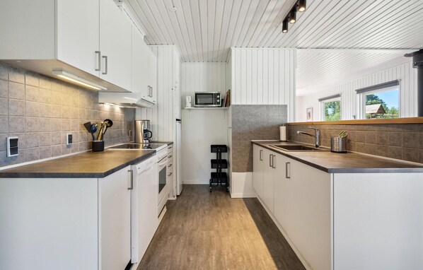 Fridge, stovetop, dishwasher, coffee/tea maker