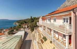 Enjoy a traditional seaside view from the upper-floor balcony.