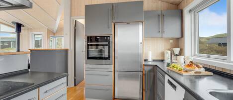 Fridge, stovetop, dishwasher, coffee/tea maker