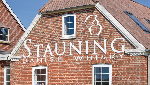 A building with a sign that reads "STAUNING DANISH WHISKY". - Gorgeous home in Skjern with sauna (Skjern)