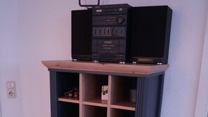 A cabinet with a shelf on top, a drawer, and a small compartment. - Ressing Vacation Rental - - Ressing Vacation Rental (Brodersby)