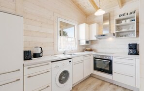 Fridge, stovetop, dishwasher, coffee/tea maker