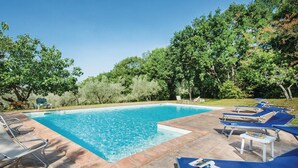 A rectangular swimming pool with clear blue water, surrounded by a tiled deck. - 4 bedroom nice home in Terni TR (Terni TR)