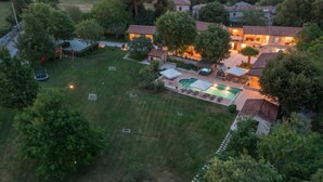 An aerial view of a residential property with a swimming pool, outdoor seating, and a well-maintained lawn. - Stunning home in Tinjan with sauna (Tinjan)