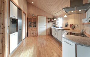 Fridge, stovetop, dishwasher, coffee/tea maker