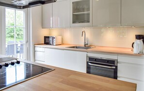 Fridge, stovetop, dishwasher, coffee/tea maker