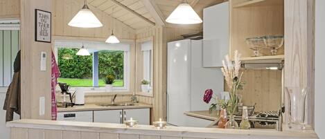 Fridge, stovetop, dishwasher, coffee/tea maker