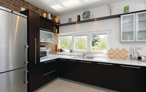 Fridge, stovetop, dishwasher, coffee/tea maker