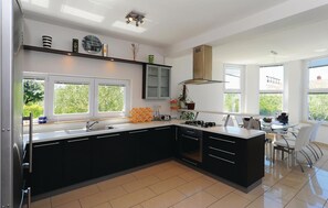 Fridge, stovetop, dishwasher, coffee/tea maker