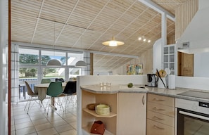Fridge, stovetop, dishwasher, coffee/tea maker