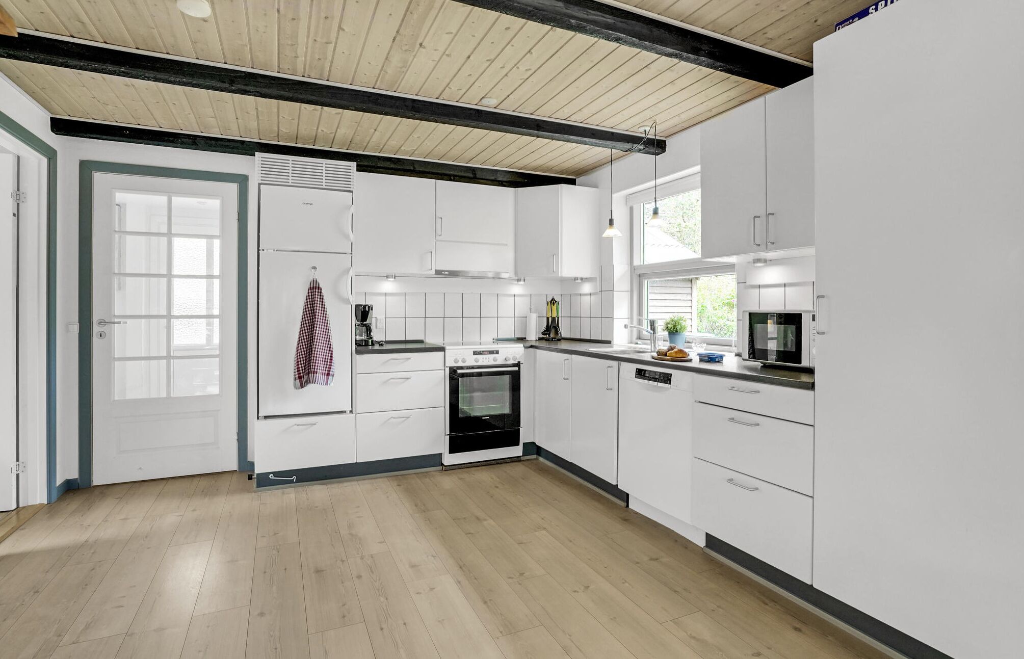 Fridge, stovetop, dishwasher, coffee/tea maker