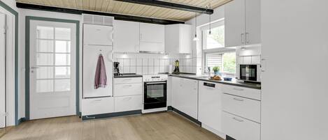 Fridge, stovetop, dishwasher, coffee/tea maker