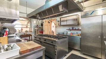 Fridge, stovetop, dishwasher, coffee/tea maker