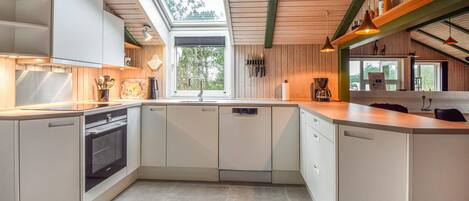Fridge, stovetop, dishwasher, coffee/tea maker