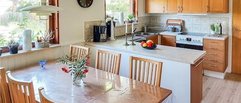 Fridge, stovetop, dishwasher, coffee/tea maker