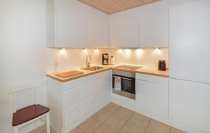 Fridge, stovetop, dishwasher, coffee/tea maker