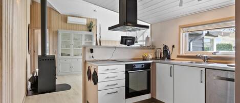 Fridge, stovetop, dishwasher, coffee/tea maker