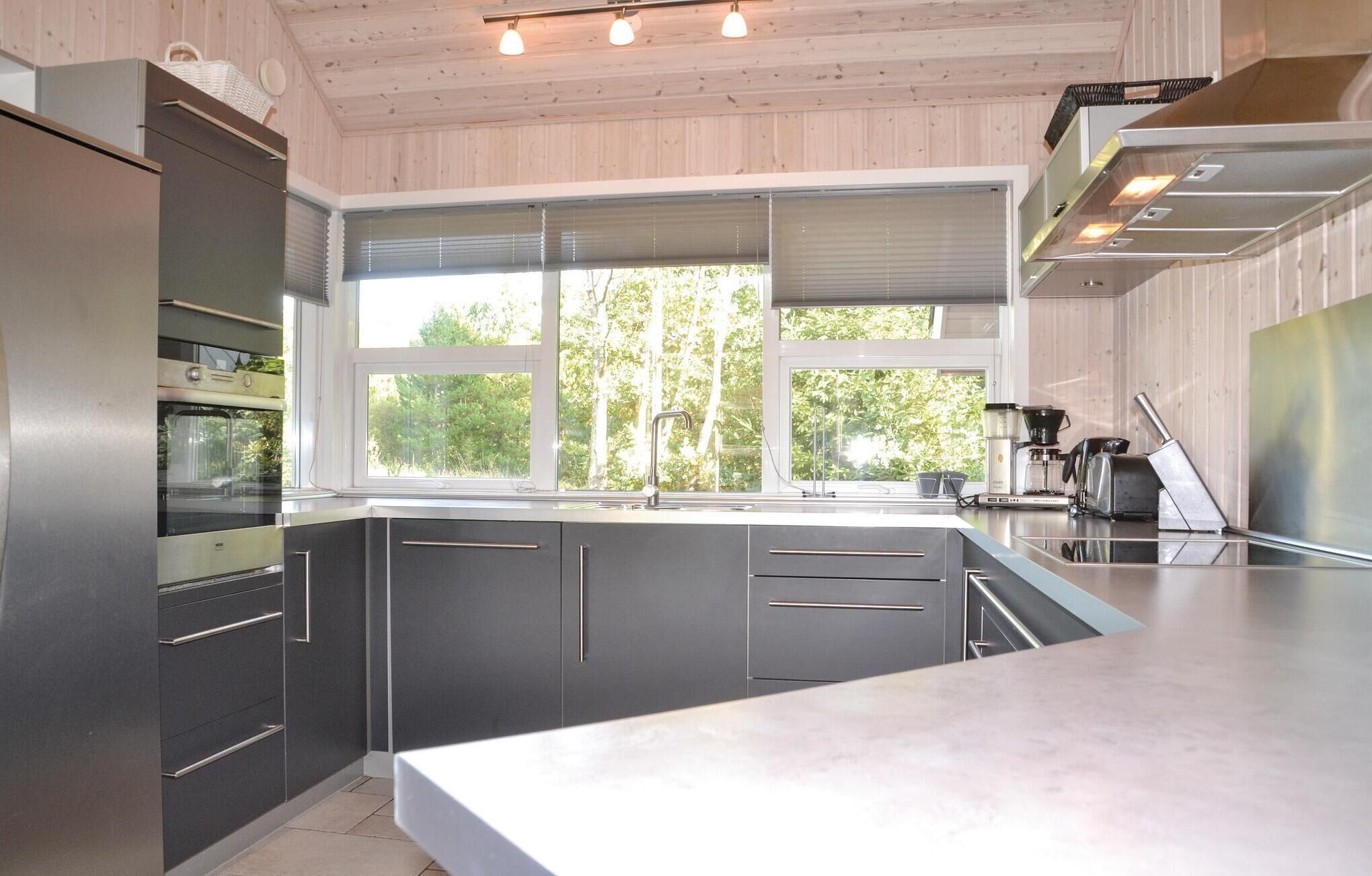 Fridge, stovetop, dishwasher, coffee/tea maker