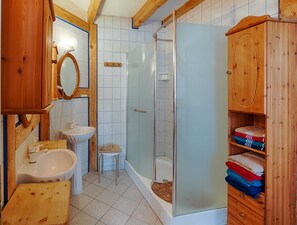 Shower, hair dryer, towels, toilet paper