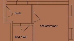 Un plan d’étage indiquant les différentes pièces : cuisine, salon, salle à manger, chambre, salle de bain et toilettes.