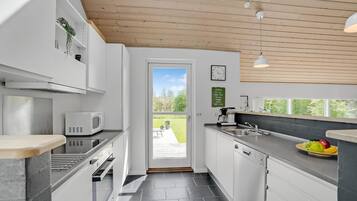 Fridge, stovetop, dishwasher, coffee/tea maker