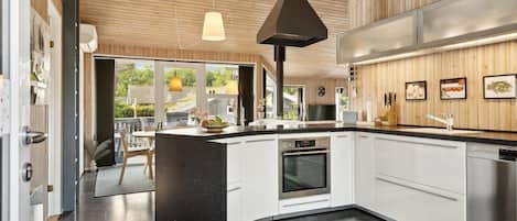 Fridge, stovetop, dishwasher, coffee/tea maker