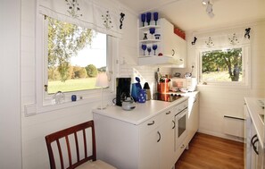 Fridge, stovetop, dishwasher, coffee/tea maker