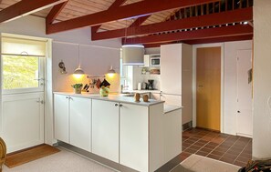 Fridge, stovetop, dishwasher, coffee/tea maker