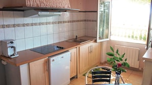 A compact kitchen with a dishwasher, a sink, and a window providing natural light. - Gorgeous home in Lavardac with kitchen (Lavardac)