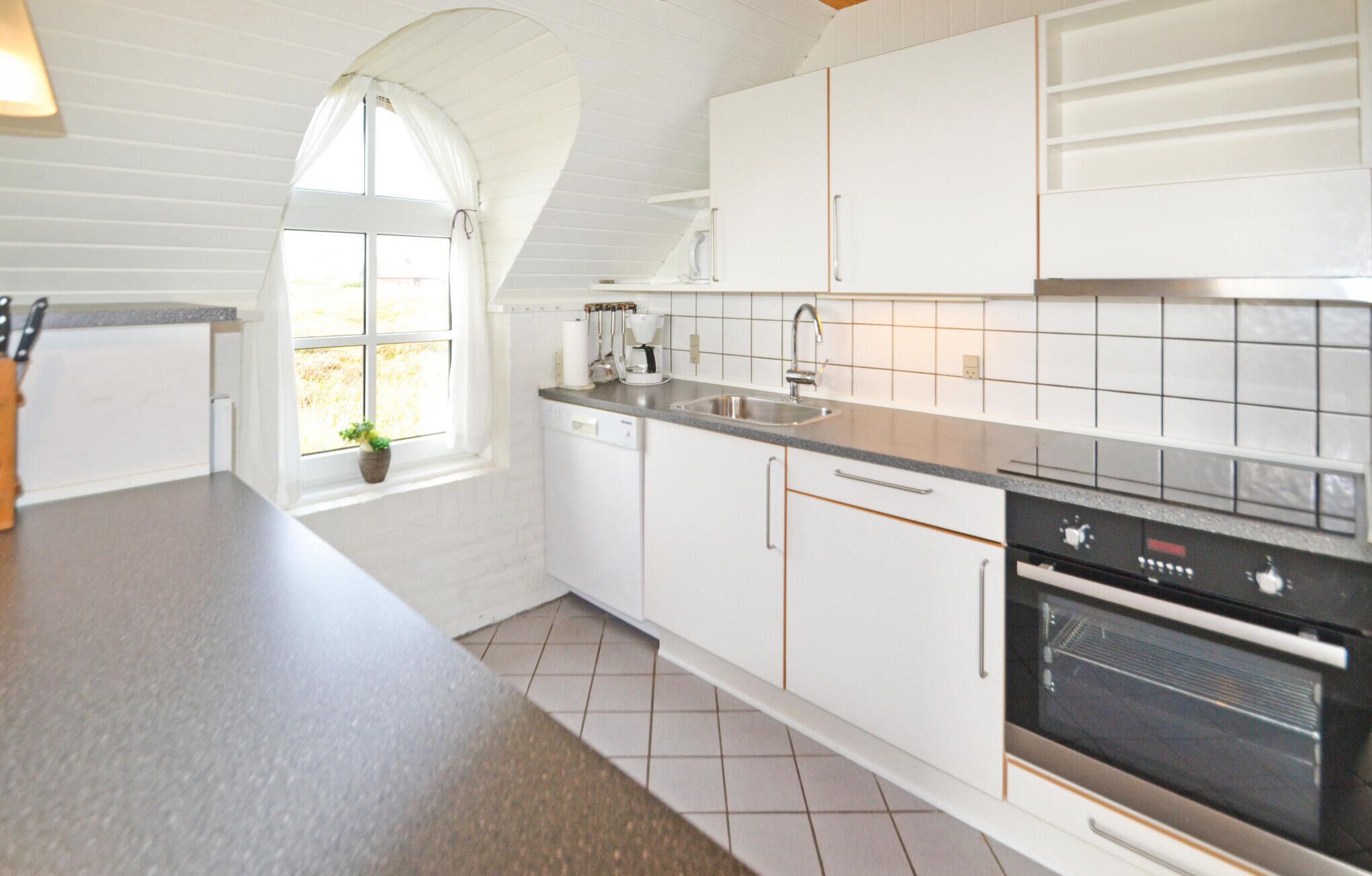 Fridge, stovetop, dishwasher, coffee/tea maker