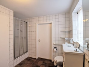 Shower, towels, soap, toilet paper