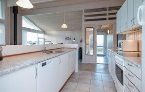 Fridge, stovetop, dishwasher, coffee/tea maker