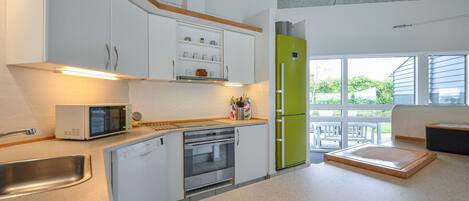 Fridge, stovetop, dishwasher, coffee/tea maker