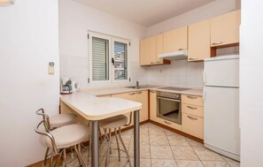 Fridge, stovetop, coffee/tea maker, cookware/dishes/utensils