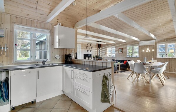 Fridge, stovetop, dishwasher, coffee/tea maker